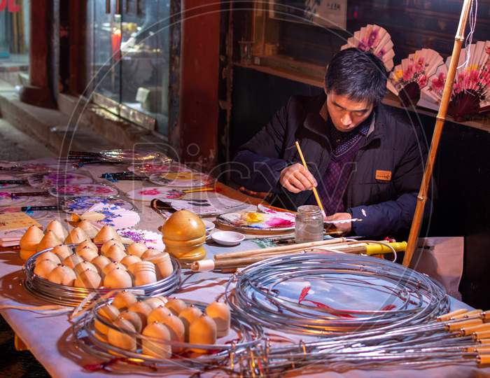 Man Making And Selling Traditional Handicrafts In Luoyang Old Town, Henan, China