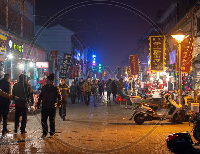 Lively Luoyang Old Town At Night, With Traditional Shops And Restaurants, China