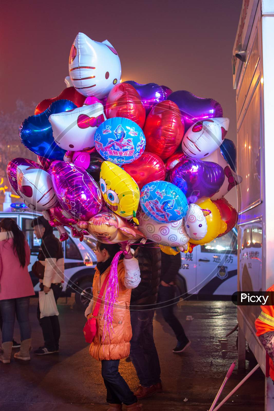 Woman Selling Helium Filled Balloons In Luoyang, Henan, China