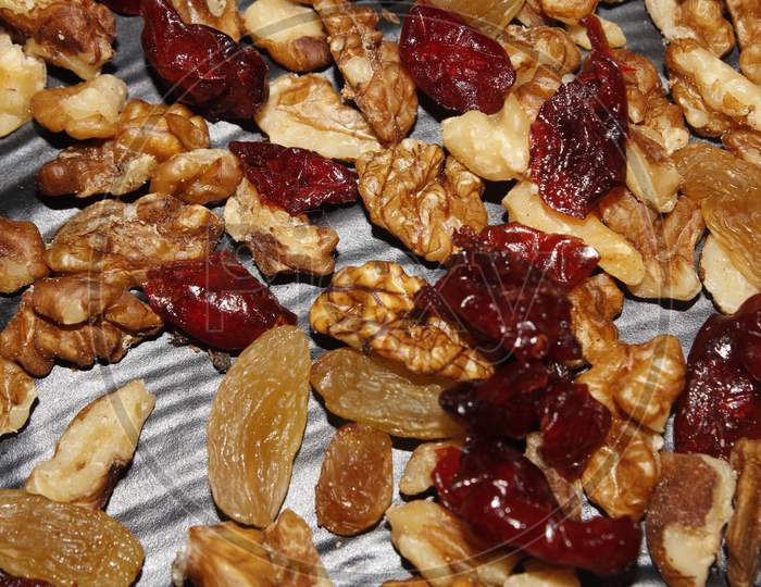 Mixed Dry Fruits Raisins Walnuts Cranberries In Black Background