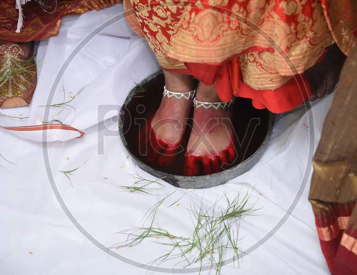 Bengali Bride'S Keeping First Foot In Milk And Rose Petal Tray At Husband'S House.