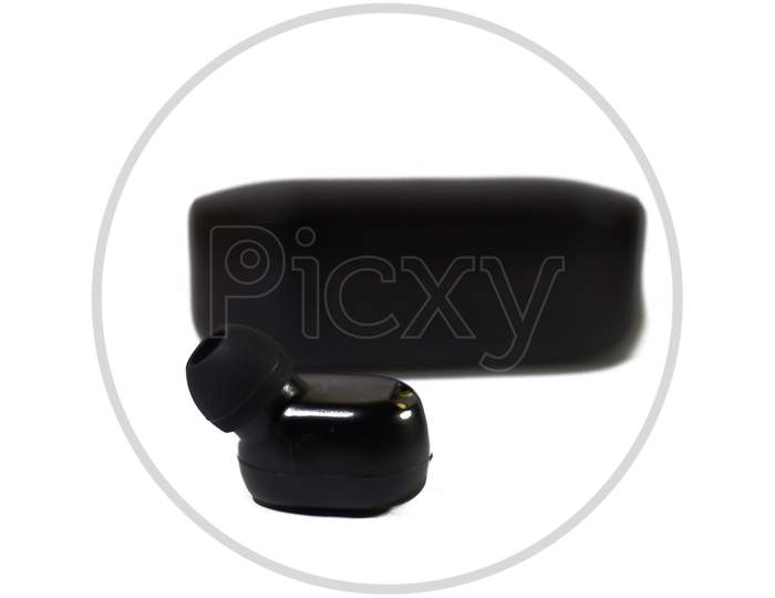 Black Wireless Earphones And The Case Isolated On White Background. True Wireless Stereo Earphones. Wireless Earphones With Its Case