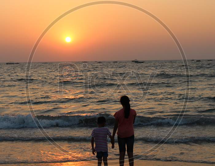 children enjoying the sunset in beaches of Goa