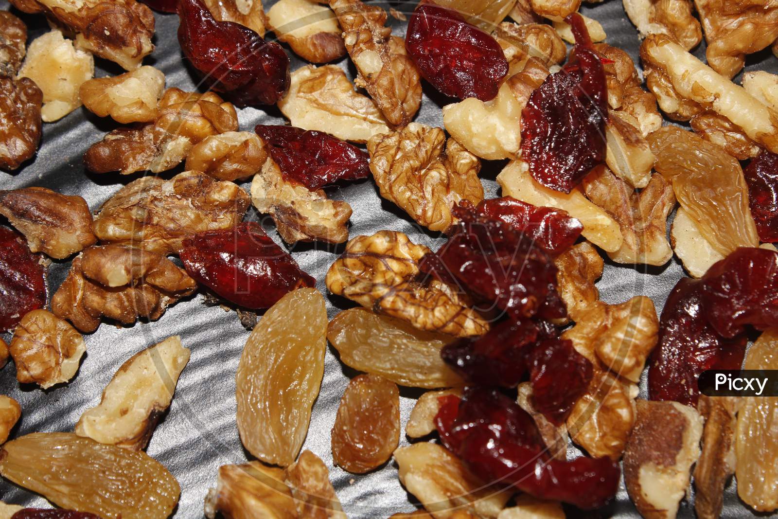 Mixed Dry Fruits Raisins Walnuts Cranberries In Black Background
