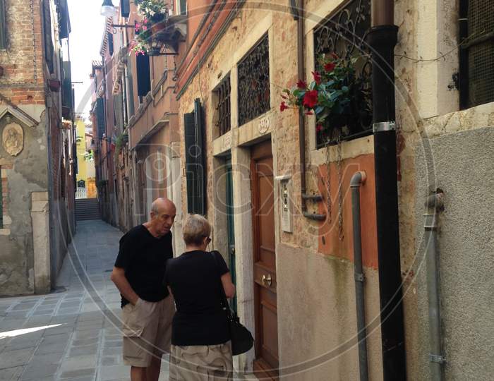 Narrow Street Venice With A Couple