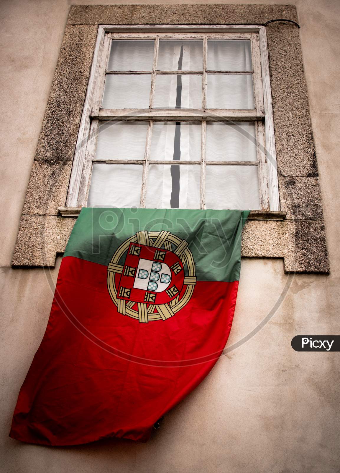 Portuguese flag at window