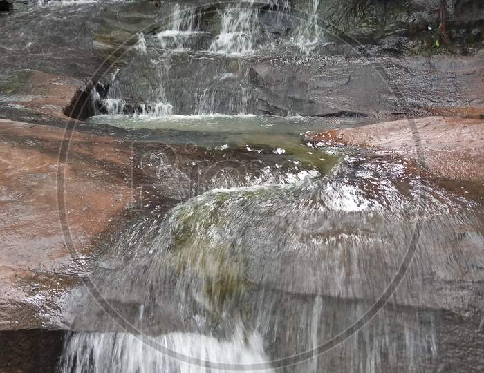 Water Flowing In Rocks