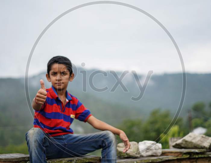 Portrait Of A Indian Pahadi Kid Who Belongs To The Mountains.