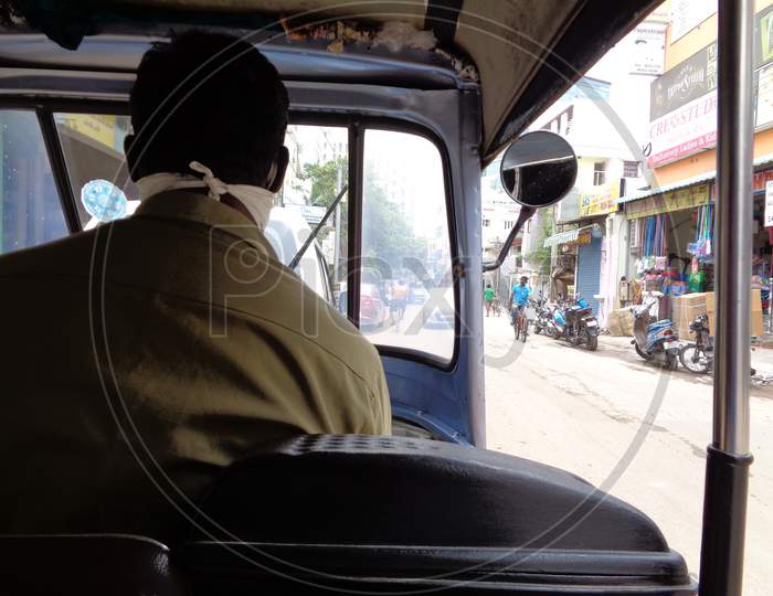 desperate auto rickshaw driver in search of passengers in the times of pandemic