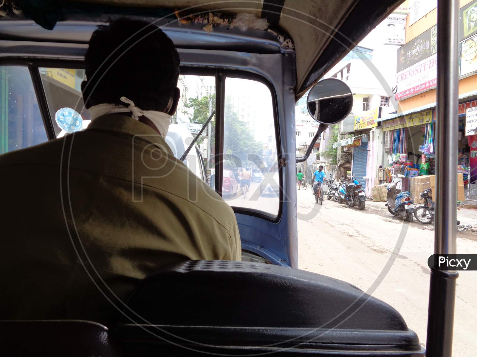 desperate auto rickshaw driver in search of passengers in the times of pandemic