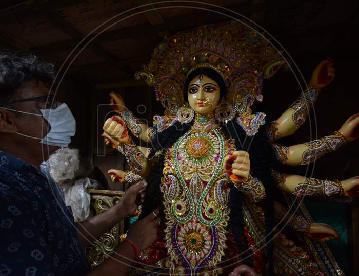 A man working on an idol for a puja in France. The order had come earlier this year but delivery has been delayed because of unlock.  on Sunday 16 august 2020