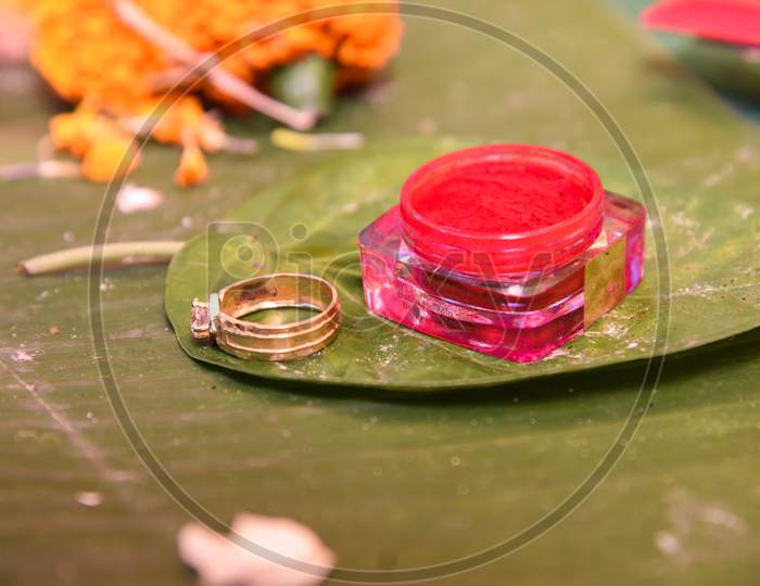 Vermilion Or Sindur And Ring Kept On Betel Leaf In Hindu Marriage.