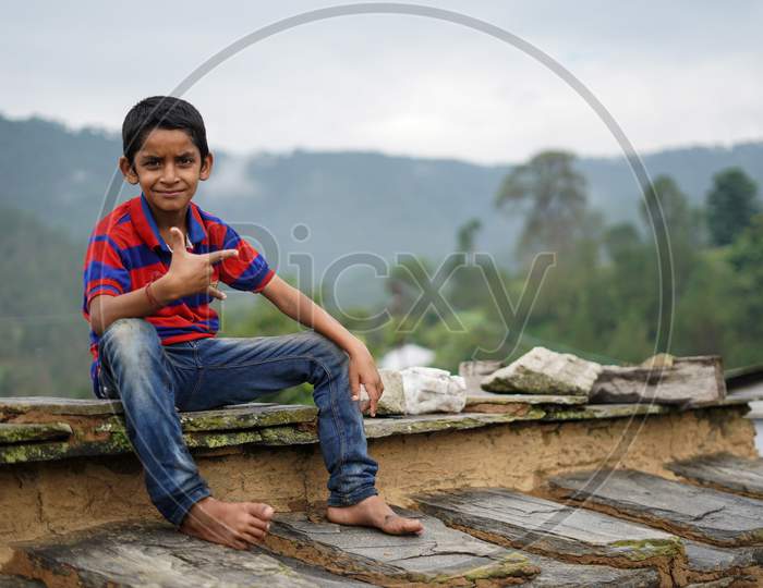 Portrait Of A Indian Pahadi Kid Who Belongs To The Mountains.