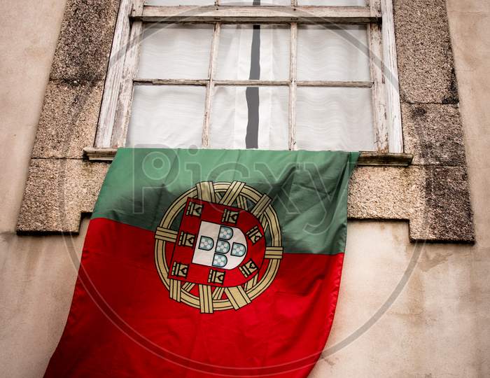 Portuguese flag at window