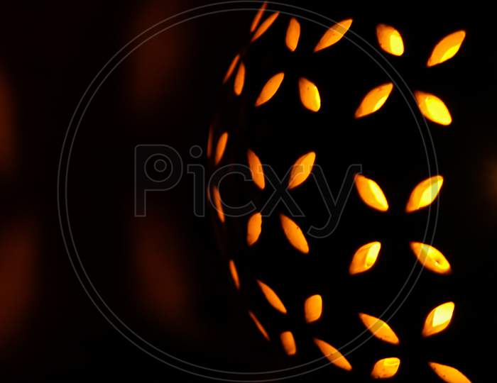 Halloween pumpkin light on black background