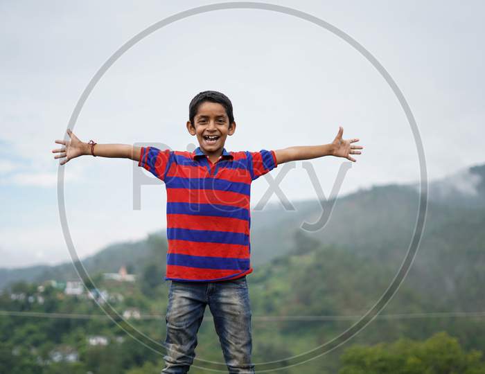 Portrait Of A Indian Pahadi Kid Who Belongs To The Mountains. Freedom And Joy