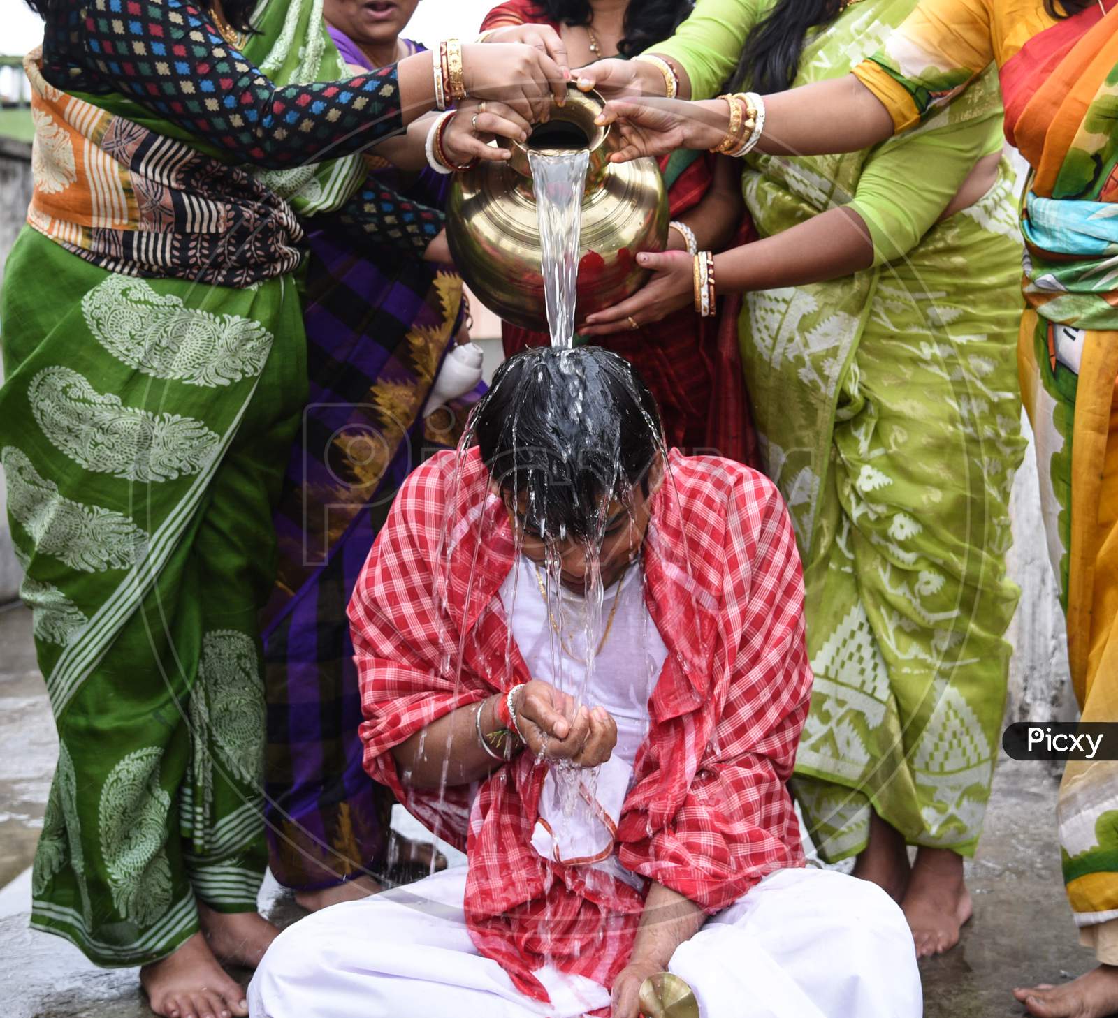 Groom Is Being Given Bath As Per Bengali Marriage Rituals.