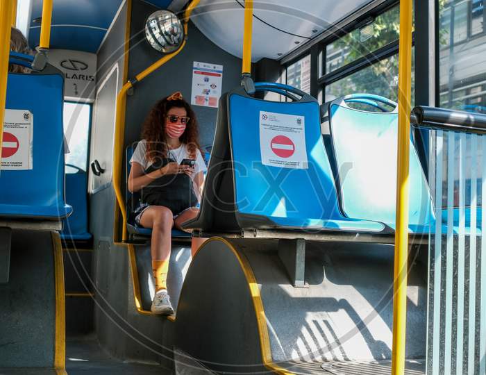 Girl Wearing A Medical Face Mask On Belgrade City Public Bus, Covid 19 Pandemic