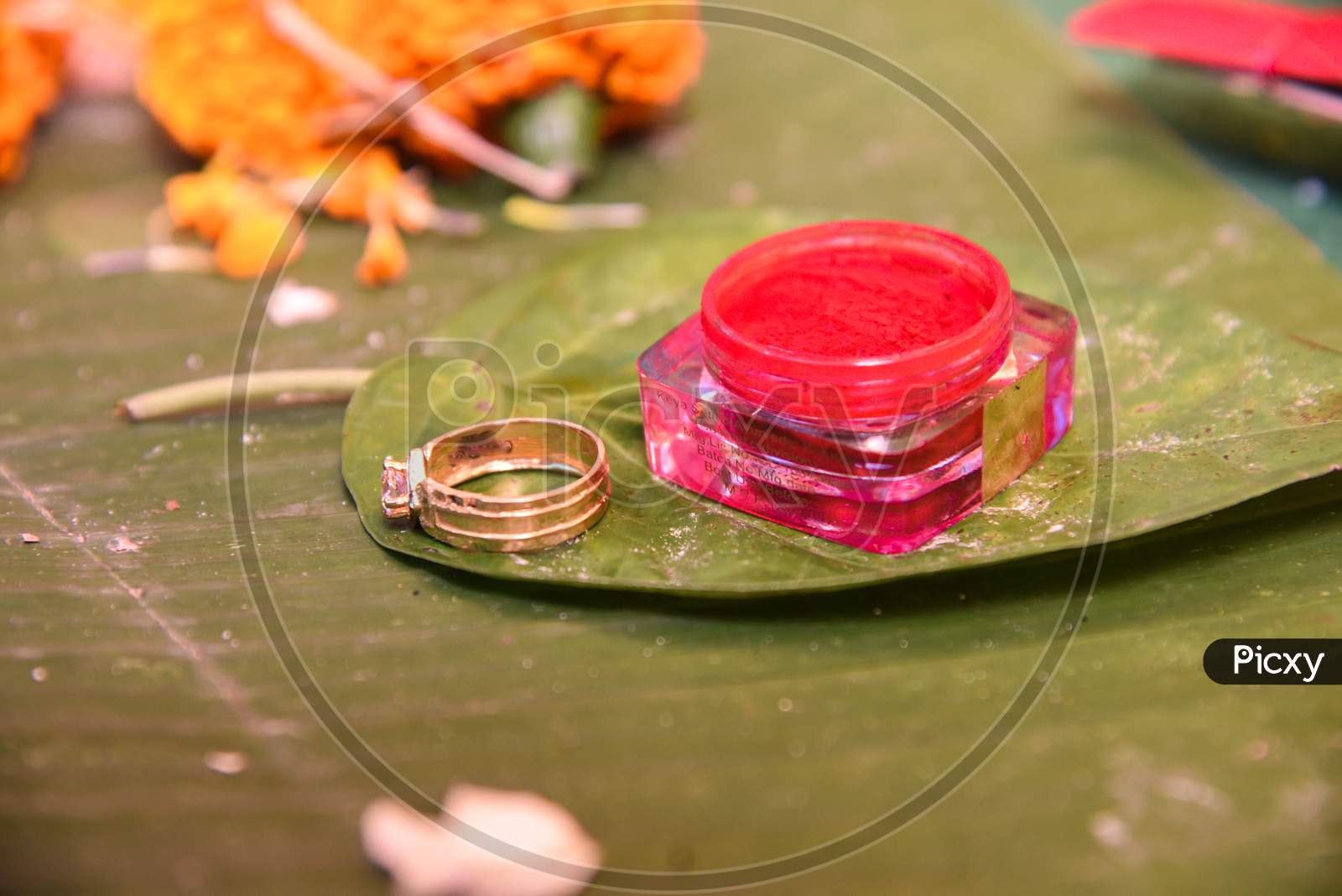 Vermilion Or Sindur And Ring Kept On Betel Leaf In Hindu Marriage.