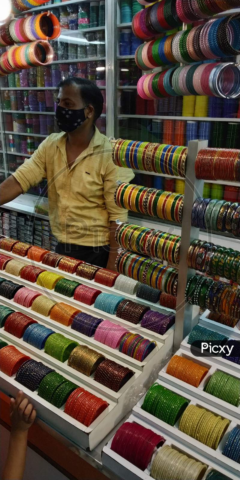 A Shopkeeper at a bangle store