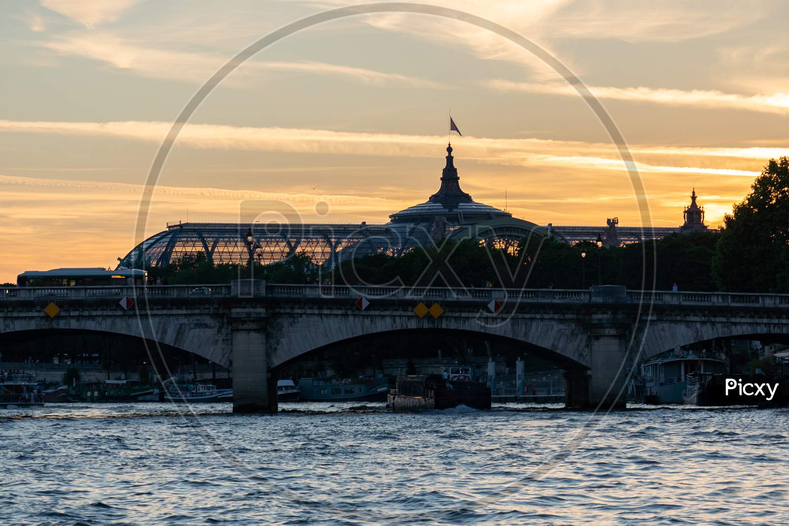Pont De La Concorde And The Grand Palais Of Paris After Sunset.