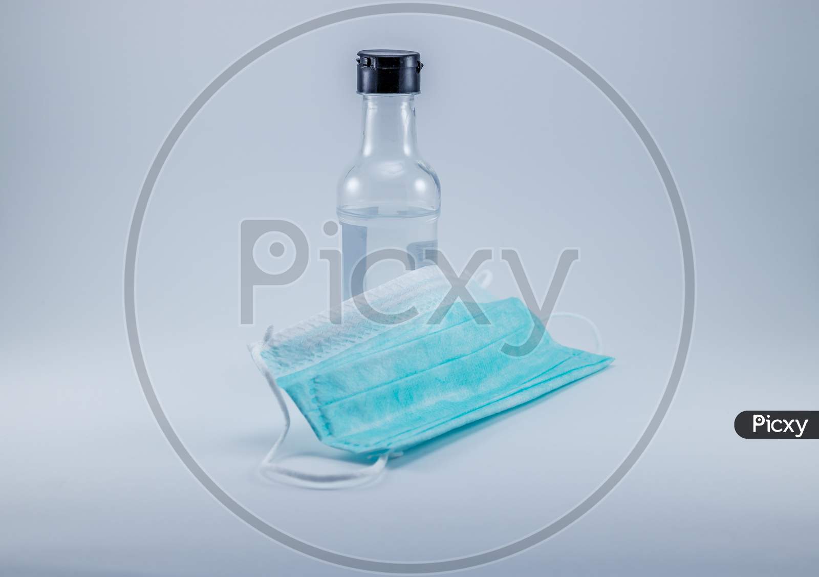 Alcohol Gel Hand Sanitizer and Disposable Hygienic or medical Mask, health care.