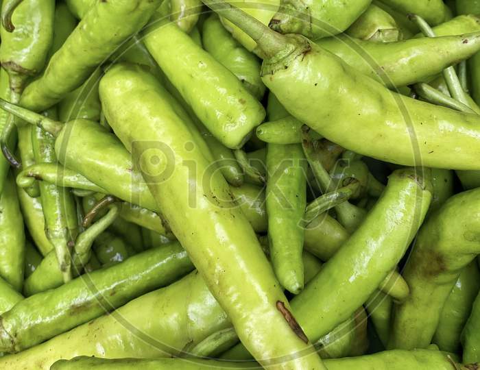 Fresh Indian Green Chillies Stacked Up In A Market