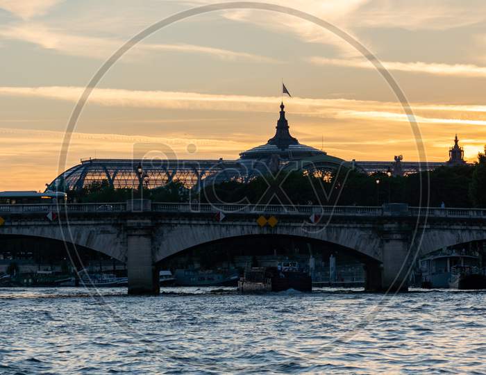 Pont De La Concorde And The Grand Palais Of Paris After Sunset.