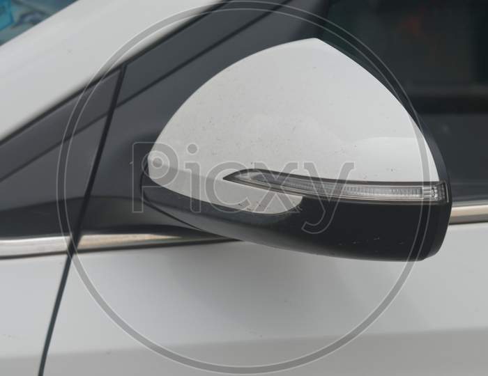 A car side mirror outer view with signal indicator