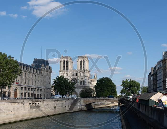 Cathedral Notre-Dame De Paris, Prefecture De Police Court And The Petit Pont Cardinal Lustiger Viewed From The Seine River Cruise, Paris. Paris - France, 31. May 2019