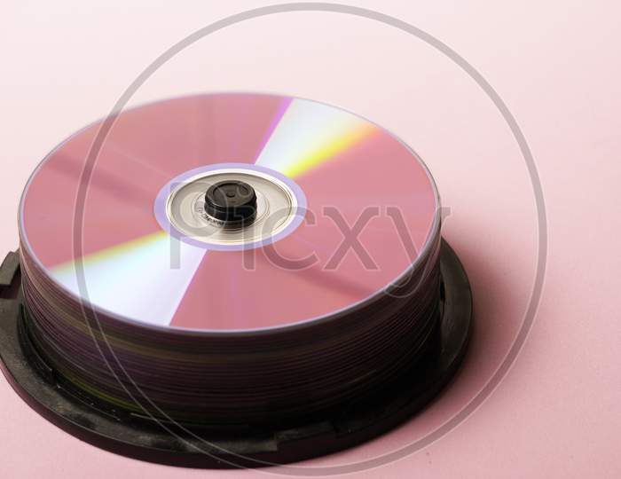 Cd Rooms Or Dvd Tower On Pink Background Flat Lay