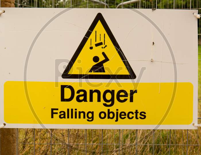 Large Danger Falling Objects Sign In Yellow And Black.