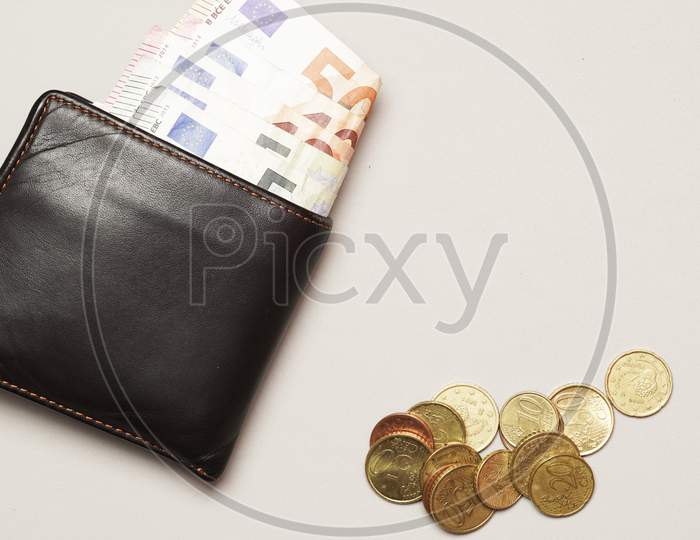 Man'S Wallet Full Of 50 Euro Bills Next To Coins. Economic Solvency. Flat Lay.