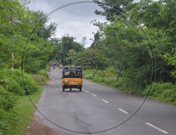 Indian village roads with Auto in a cloudy day