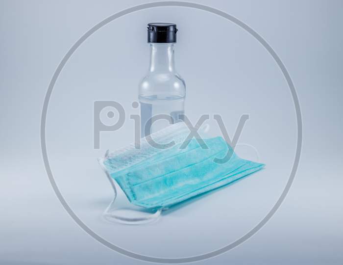 Alcohol Gel Hand Sanitizer and Disposable Hygienic or medical Mask, health care.