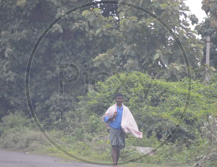 Indian village man walking on the road