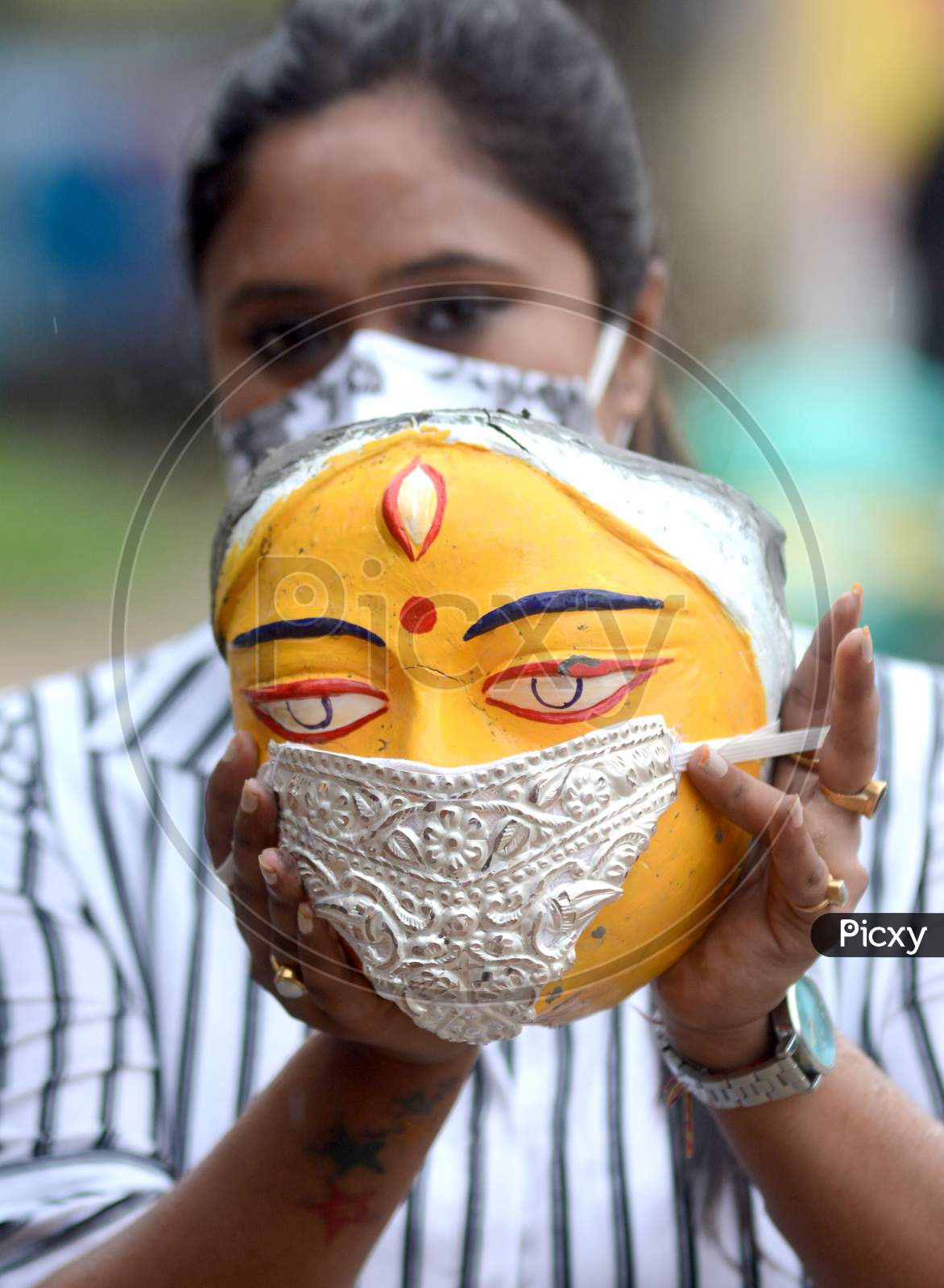 A Puja Committee decorate Silver Face Mask use an idol of goddess Durga being Durga Puja festival, in Kolkata on Monday 17 august 2020
