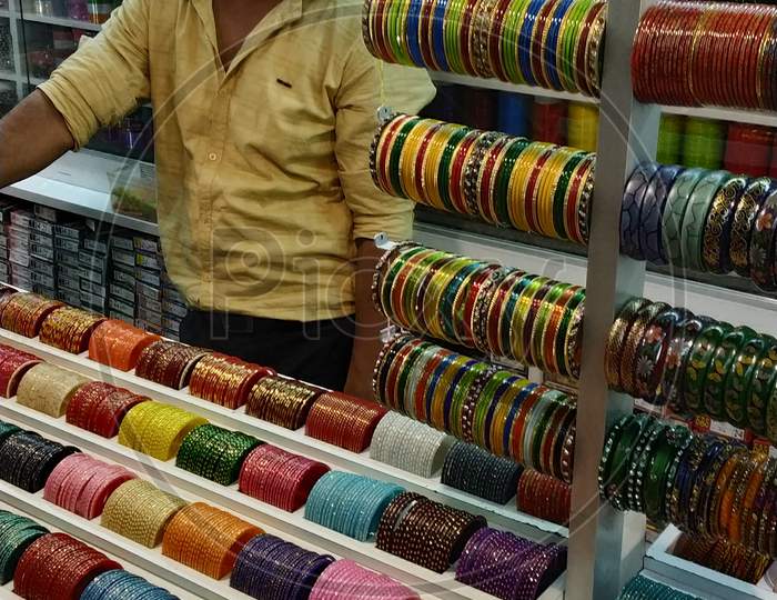 A Shopkeeper at a bangle store