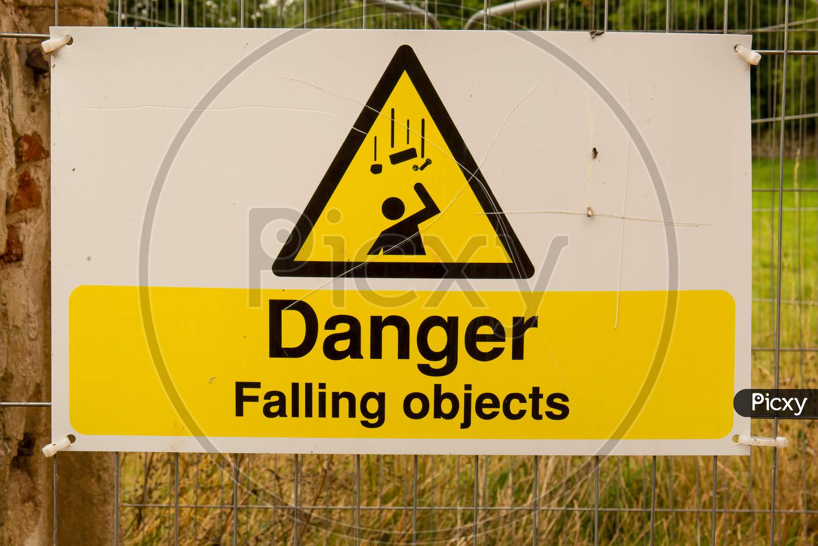 Large Danger Falling Objects Sign In Yellow And Black.