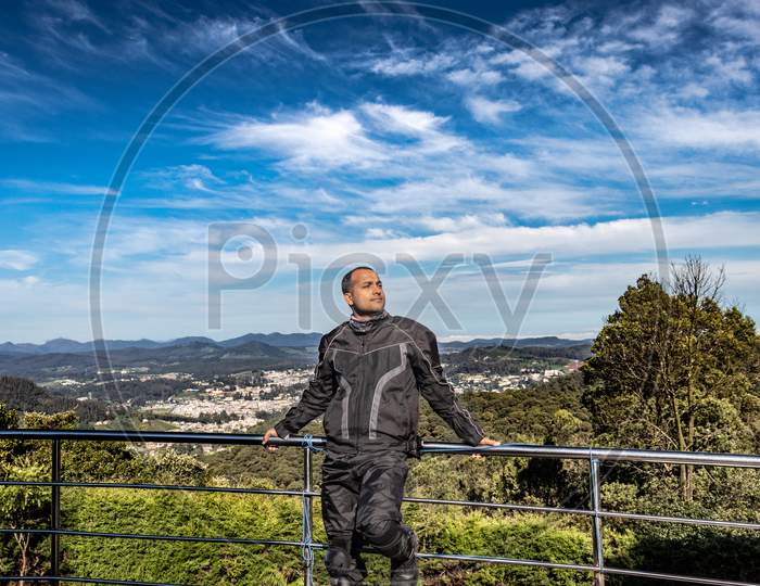 Man Isolated With Amazing Blue Sky And Mountain Range From Hill Top At Day