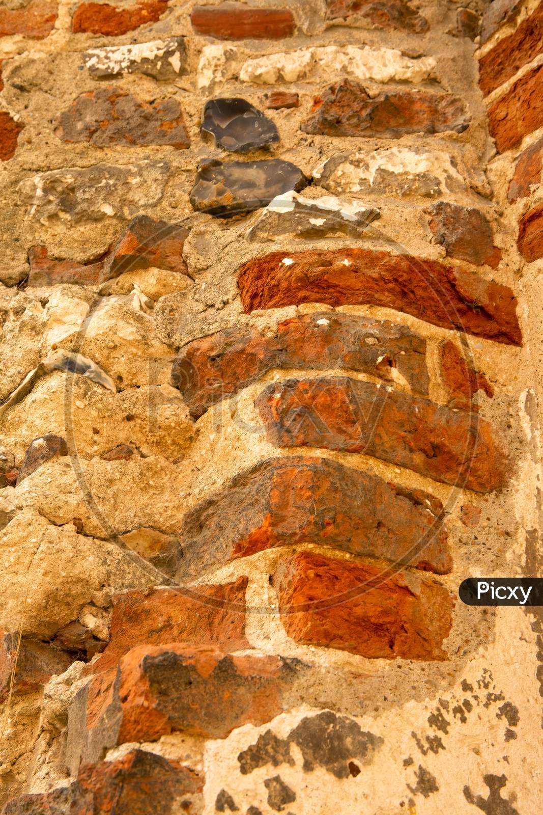 Gorgeous Textured Surface Of Ancient Ruins. Old English Bricks Weathered By The Centuries