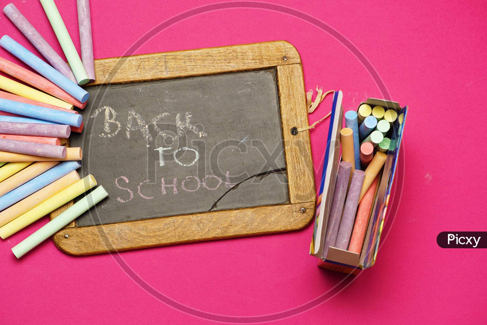 Top View Of Blackboard With Chalks And Back To School Message. Flat Lay. Flat Design