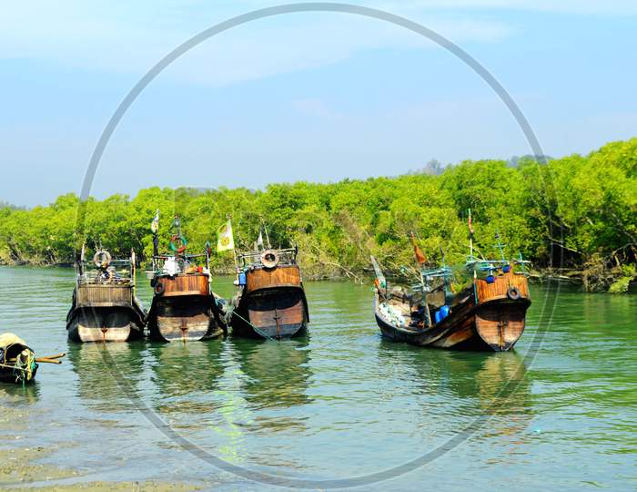 Traditional Fishing Boat Stand On Beautiful River