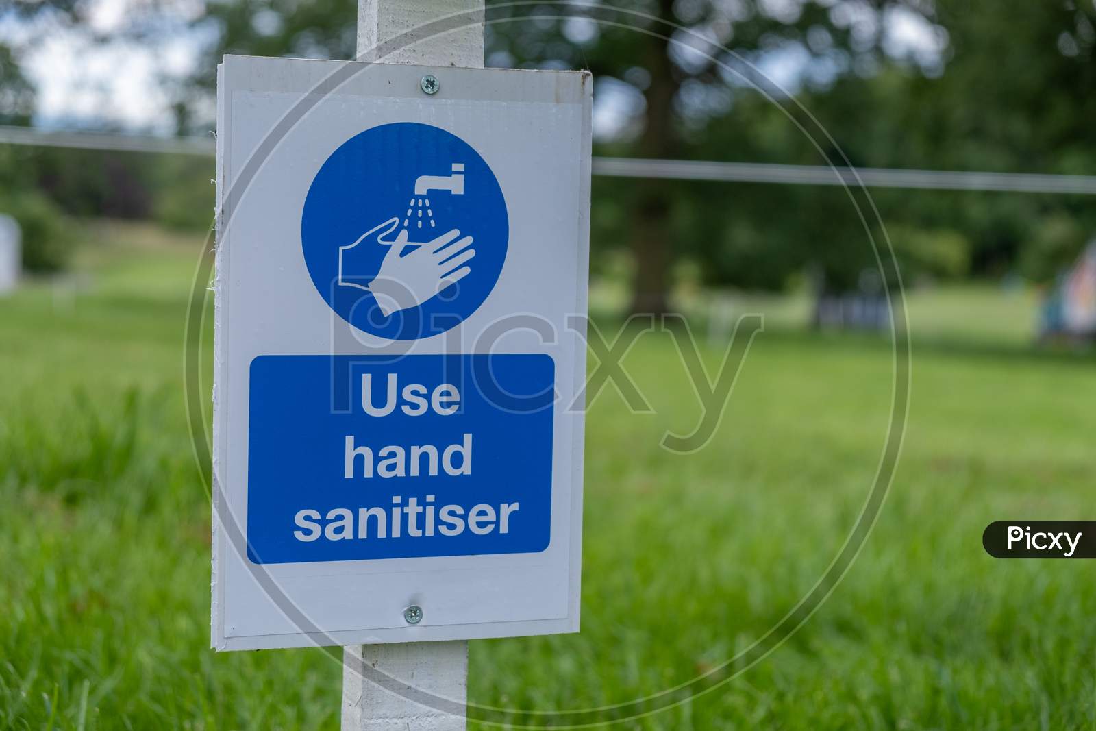 A Sign Asking Visitors To Use Hand Sanitiser At An Outdoor Event As The Coronavirus Lockdown Eases In England