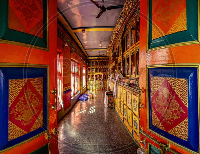 Beautiful colourful doorways with brightly coloured prayer flags decorate the doors of Thiksey Monastery in Ladakh, India