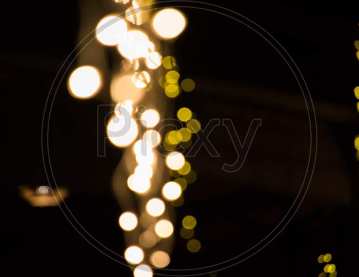 Background With White And Yellow Bokeh Lights With Empty Space For Text