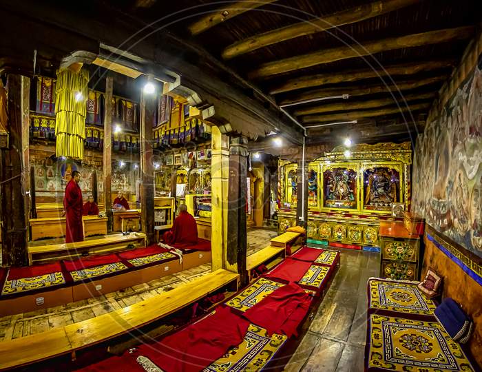 The old antique, rich and colourful interior of the Thiksey Monastery in Ladakh, India
