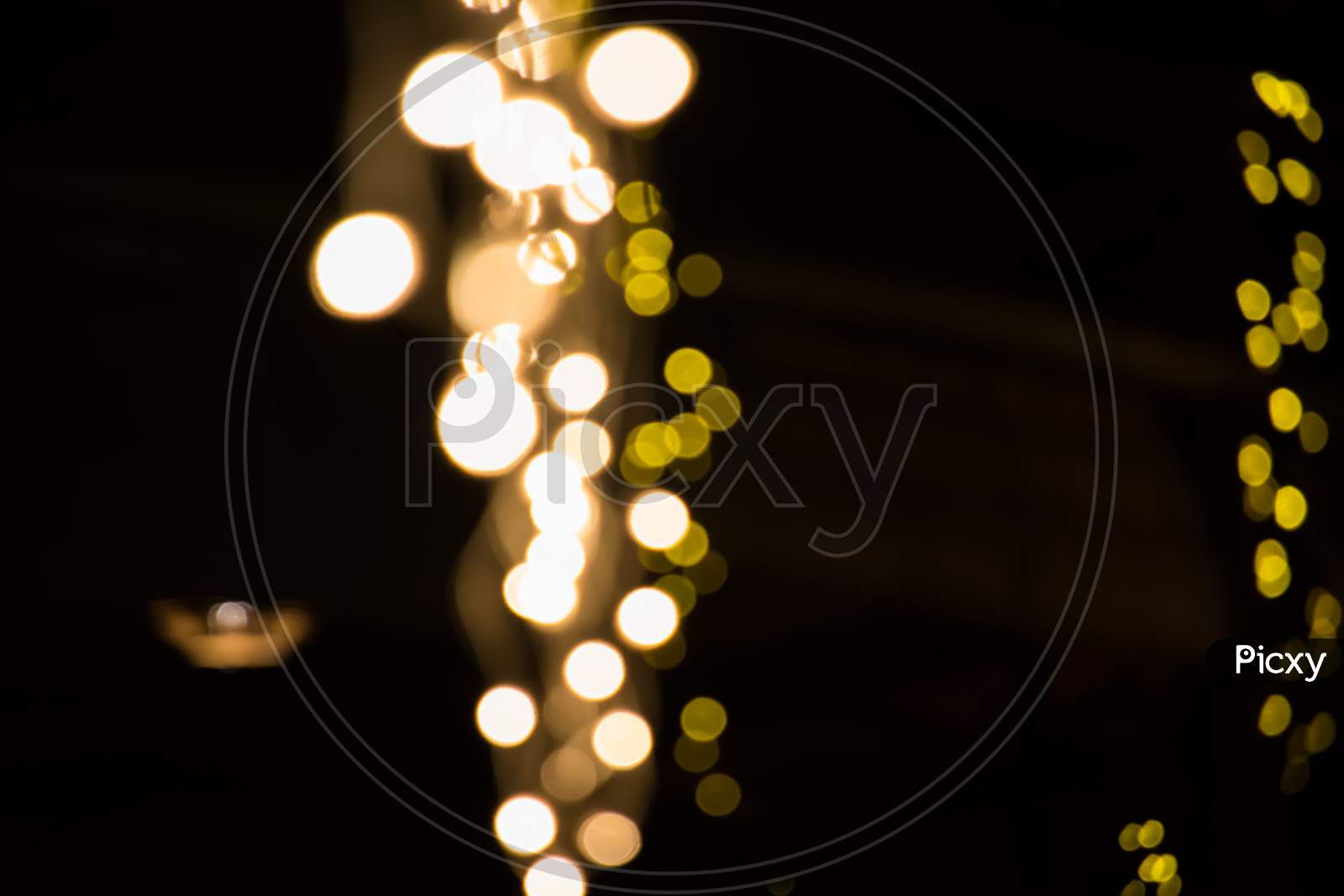 Background With White And Yellow Bokeh Lights With Empty Space For Text