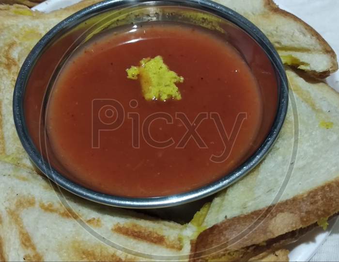 Indian style plain sandwich with red or green Sauce and  served in plate on white  background 15 Aug 2020