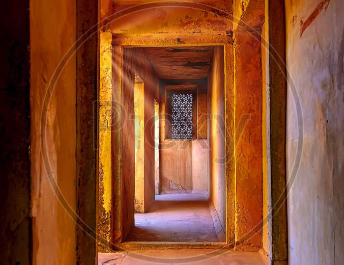 Light shining into the doorway passage of the Jaipur Amber Red Fort, India